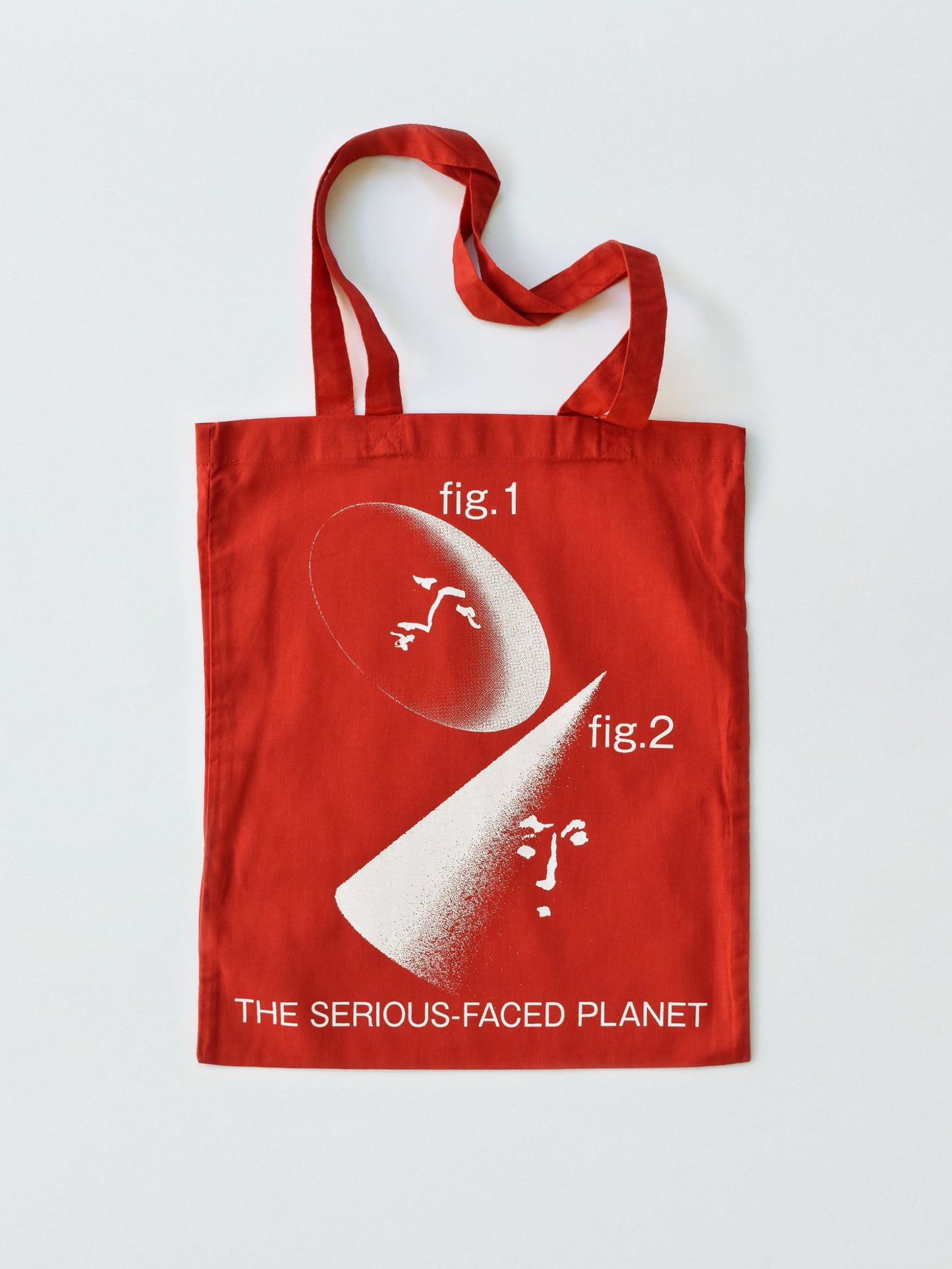 THE SERIOUS-FACED PLANET TOTE BAG